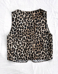 Chaleco animal print con moños
