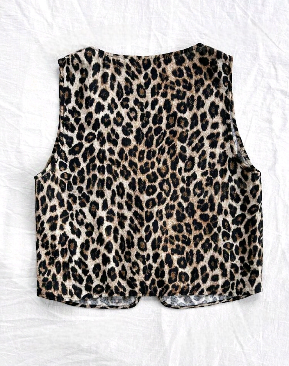 Chaleco animal print con moños